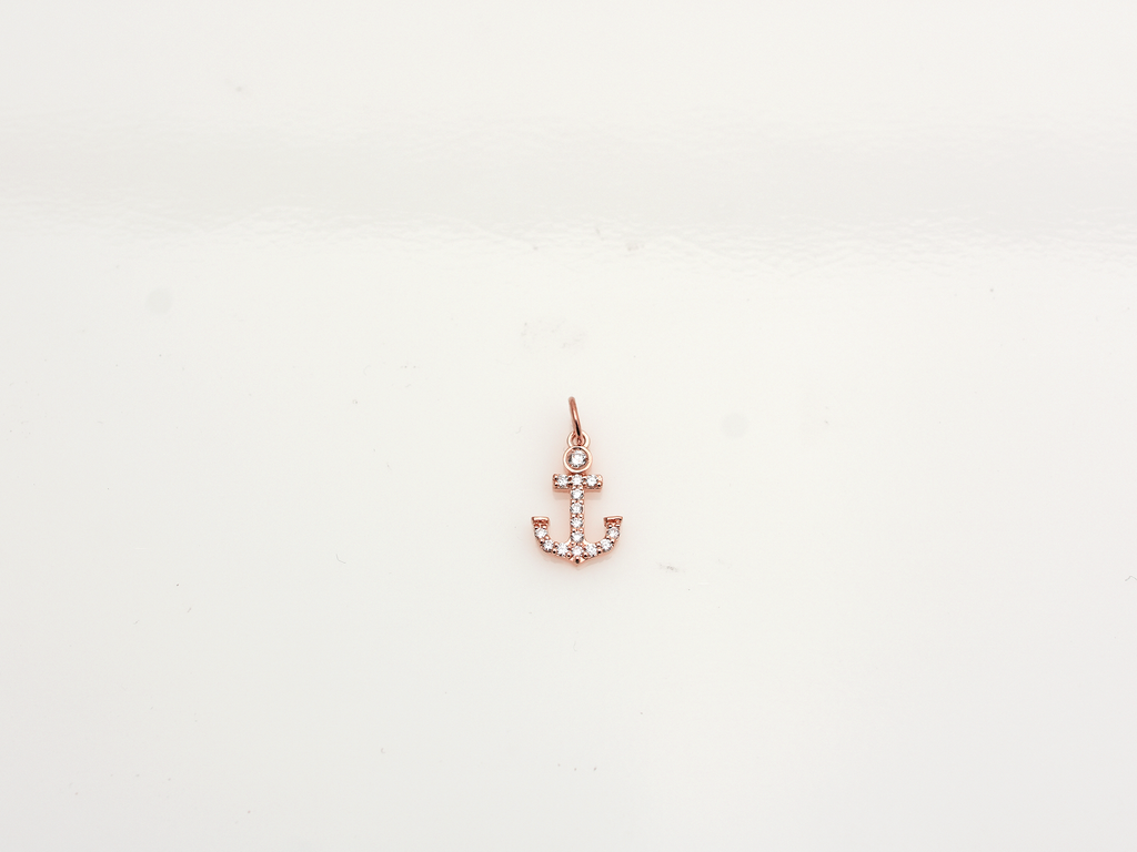 14k Gold and diamond Anchor necklace pendant with a 14k solid gold cable link chain, the diamonds are prong set and bezel set sliding on the chain displayed on a white background