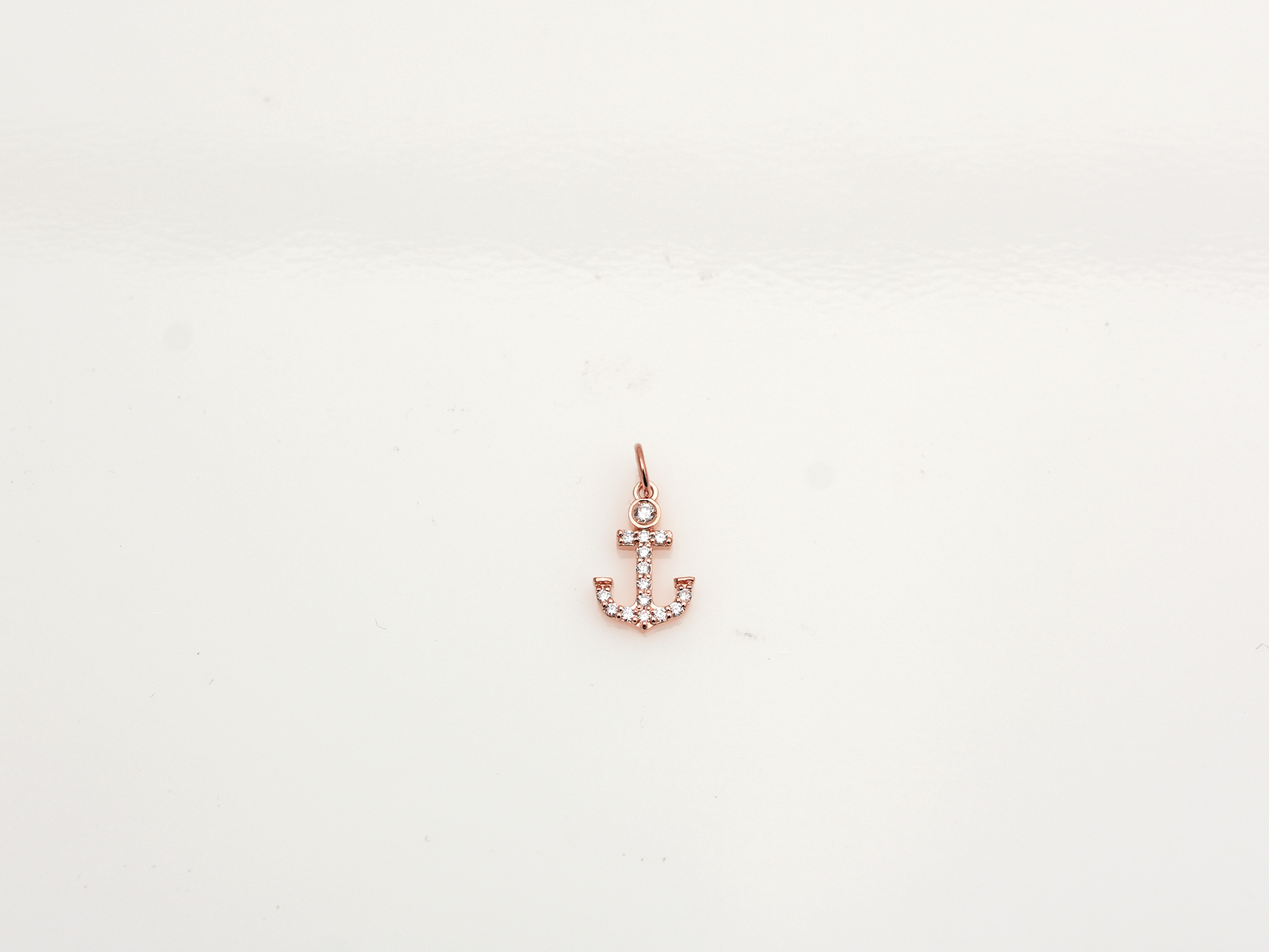 14k Gold and diamond Anchor necklace pendant with a 14k solid gold cable link chain, the diamonds are prong set and bezel set sliding on the chain displayed on a white background