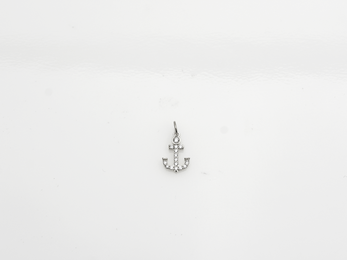 14k Gold and diamond Anchor necklace pendant with a 14k solid gold cable link chain, the diamonds are prong set and bezel set sliding on the chain displayed on a white background