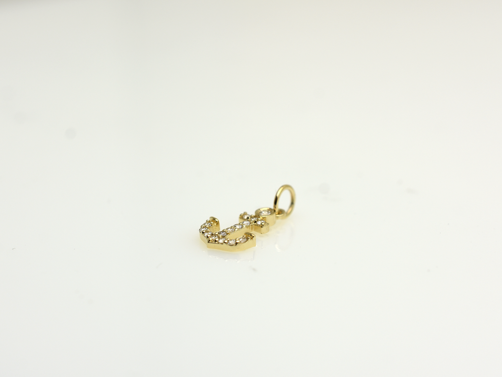 14k Gold and diamond Anchor necklace pendant with a 14k solid gold cable link chain, the diamonds are prong set and bezel set sliding on the chain displayed on a white background
