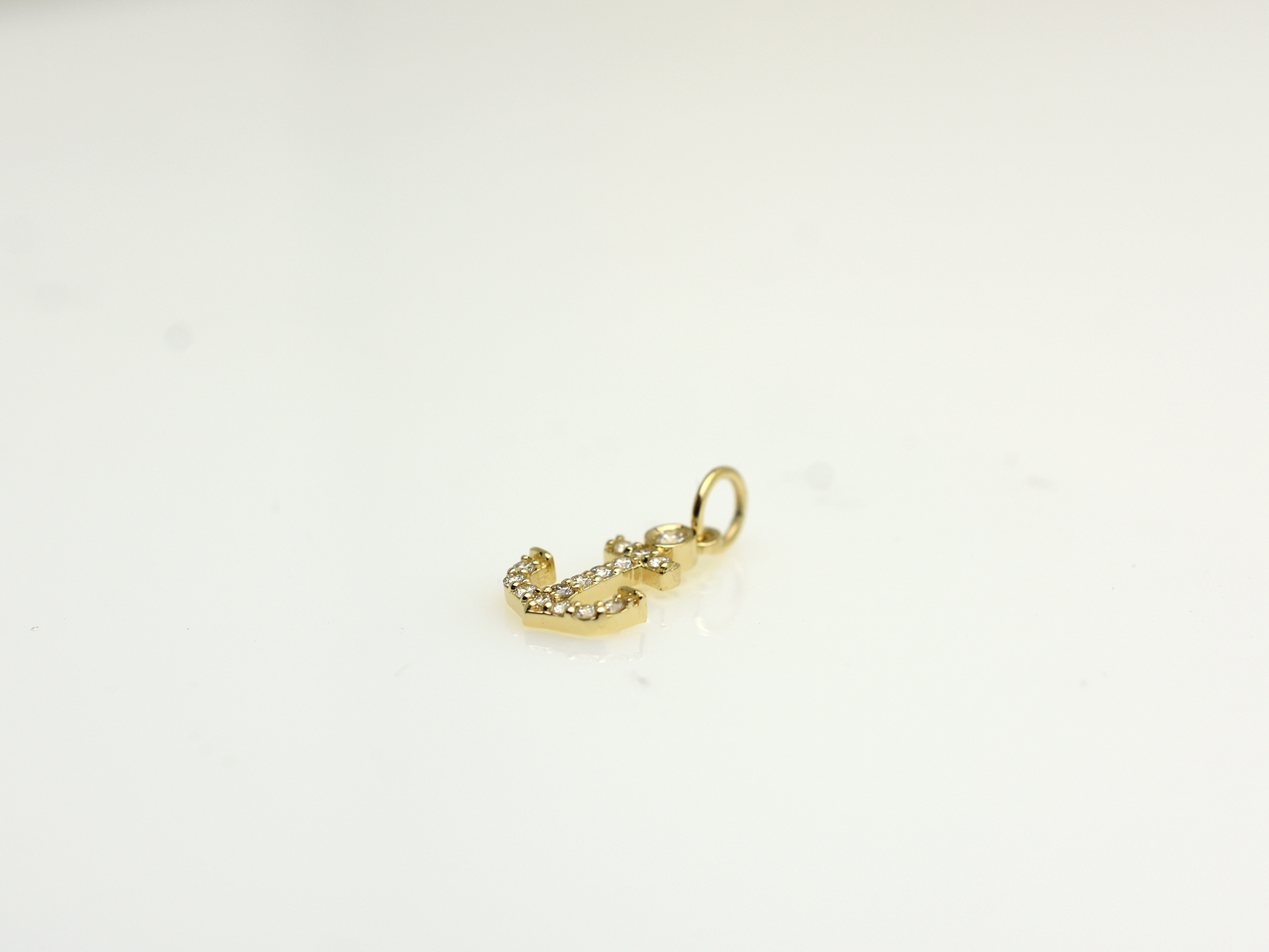 14k Gold and diamond Anchor necklace pendant with a 14k solid gold cable link chain, the diamonds are prong set and bezel set sliding on the chain displayed on a white background