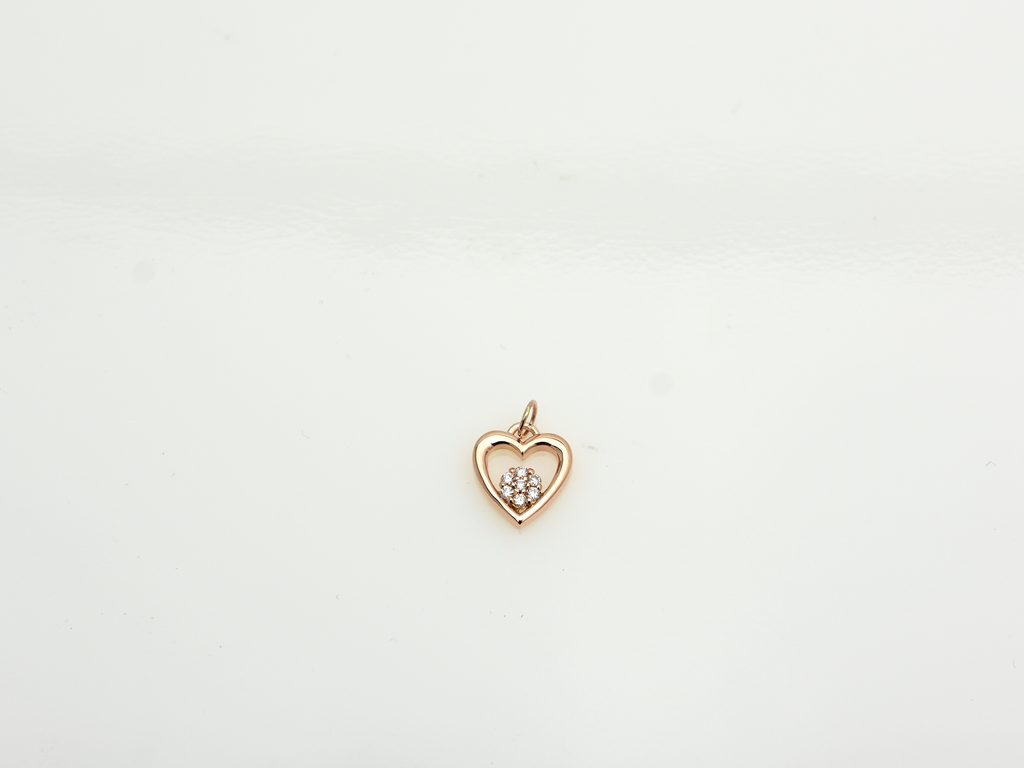 featuring a 14k gold heart necklace with a flower cluster motive 11 mm in dimension . the chain is a 14k sold gold cable link chain with a lobster lock 