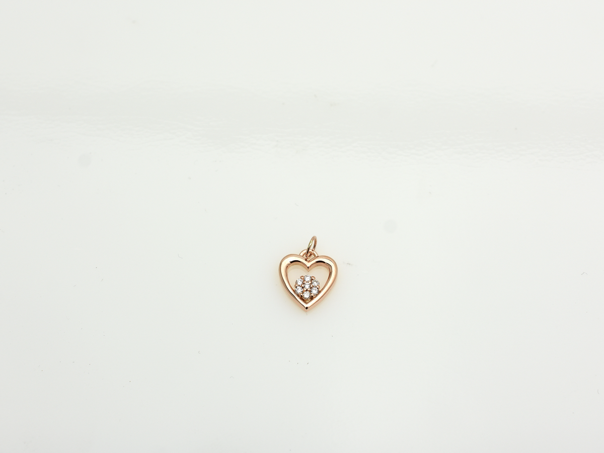 featuring a 14k gold heart necklace with a flower cluster motive 11 mm in dimension . the chain is a 14k sold gold cable link chain with a lobster lock 