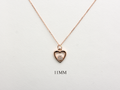 featuring a 14k gold heart necklace with a flower cluster motive 11 mm in dimension . the chain is a 14k sold gold cable link chain with a lobster lock 