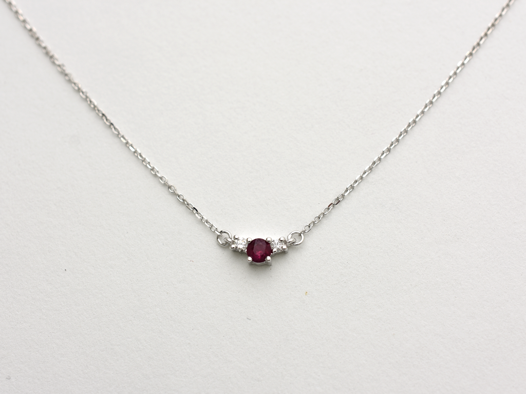 14k gold diamond and ruby necklace . past present and future design mini size pendant. the chain is a 0.8 mm cable link chain dainty and everyday look on a white background