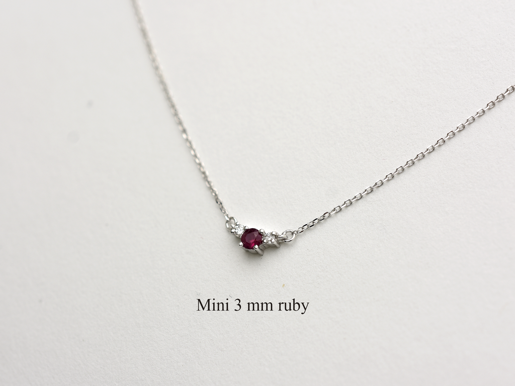 14k gold diamond and ruby necklace . past present and future design mini size pendant. the chain is a 0.8 mm cable link chain dainty and everyday look on a white background