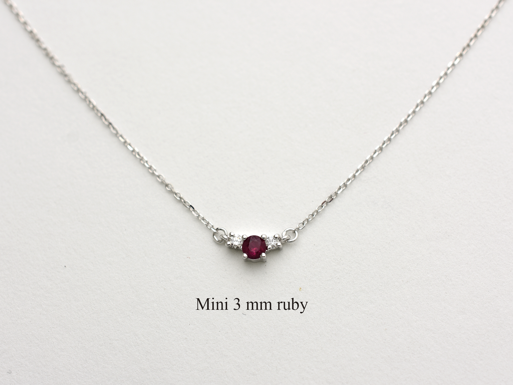 14k gold diamond and ruby necklace . past present and future design mini size pendant. the chain is a 0.8 mm cable link chain dainty and everyday look on a white background