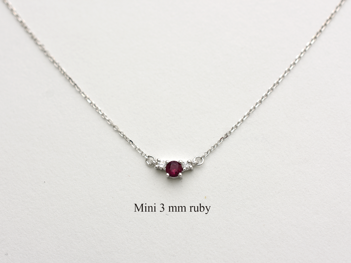14k gold diamond and ruby necklace . past present and future design mini size pendant. the chain is a 0.8 mm cable link chain dainty and everyday look on a white background