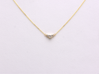 featuring a dainty three-stone diamond cluster pendant. The centerpiece consists of one slightly larger round brilliant cut stone flanked by two smaller stones in a minimalist prong setting on a fine gold cable chain with a lobster claw clasp
