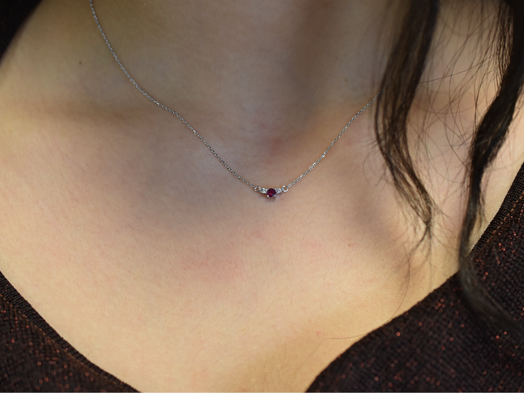 14k gold diamond and ruby necklace . past present and future design mini size pendant. the chain is a 0.8 mm cable link chain dainty and everyday look on a model