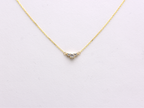  featuring a dainty three-stone diamond cluster pendant. The centerpiece consists of one slightly larger round brilliant cut stone flanked by two smaller stones in a minimalist prong setting on a fine gold cable chain with a lobster claw clasp