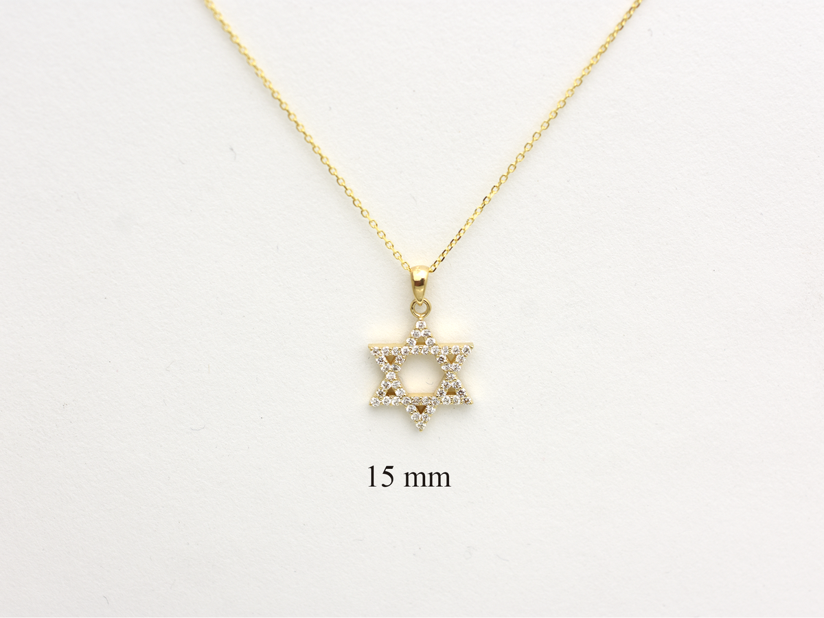 A gold-colored necklace with a Star of David pendant. The pendant is 15 mm in size and is encrusted with natural diamonds. The chain is delicate and hangs against a white background.