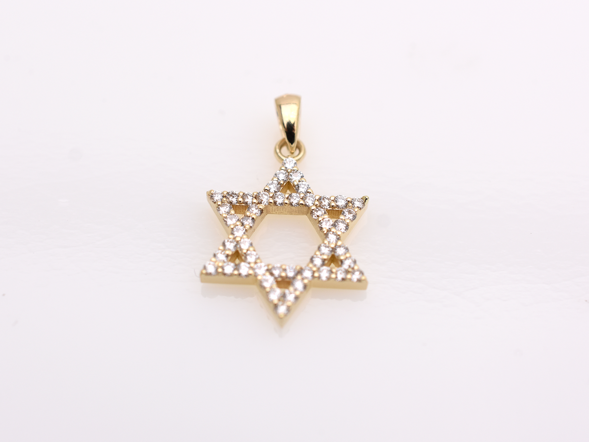 A gold-colored necklace with a Star of David pendant. The pendant is 15 mm in size and is encrusted with small, clear gemstones. The chain is delicate and hangs against a white background.