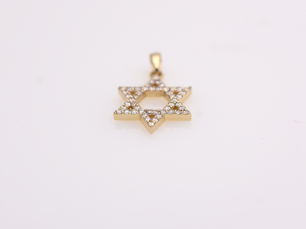 A gold-colored necklace with a Star of David pendant. The pendant is 15 mm in size and is encrusted with small, clear gemstones. The chain is delicate and hangs against a white background.
