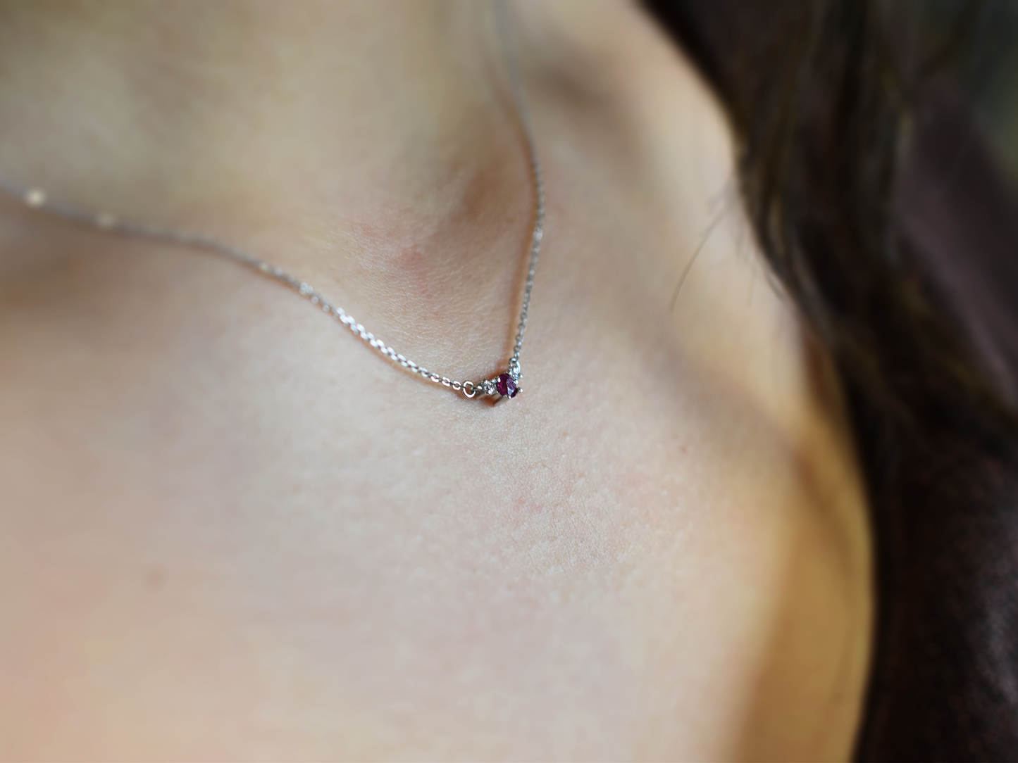 14k gold diamond and ruby necklace . past present and future design mini size pendant. the chain is a 0.8 mm cable link chain dainty and everyday look on a model