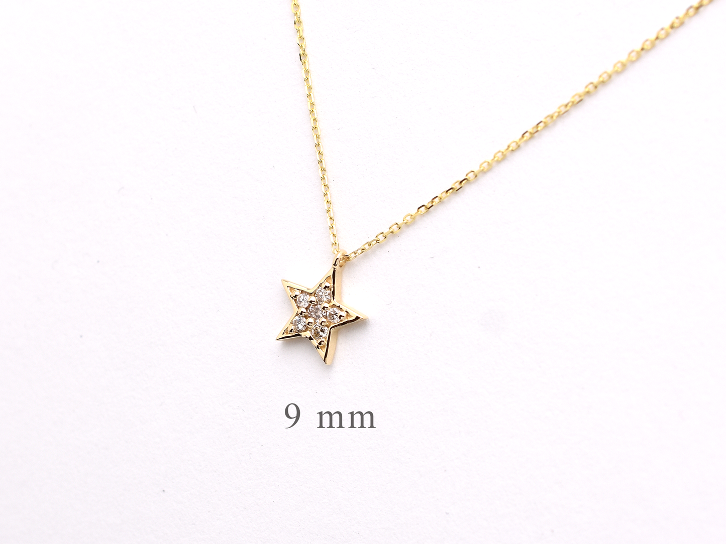 14k yellow gold diamond star necklace side view