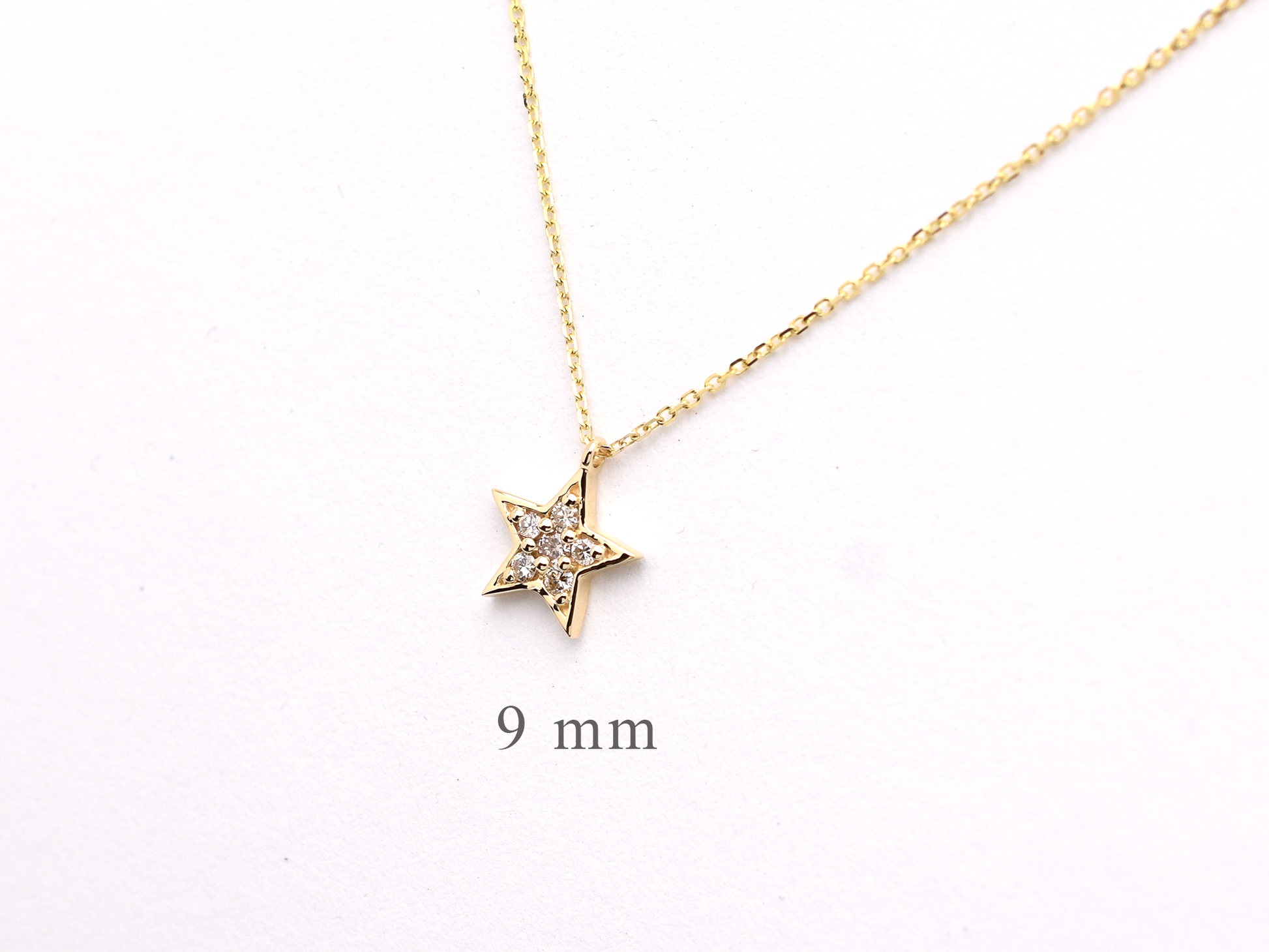 14k yellow gold diamond star necklace side view