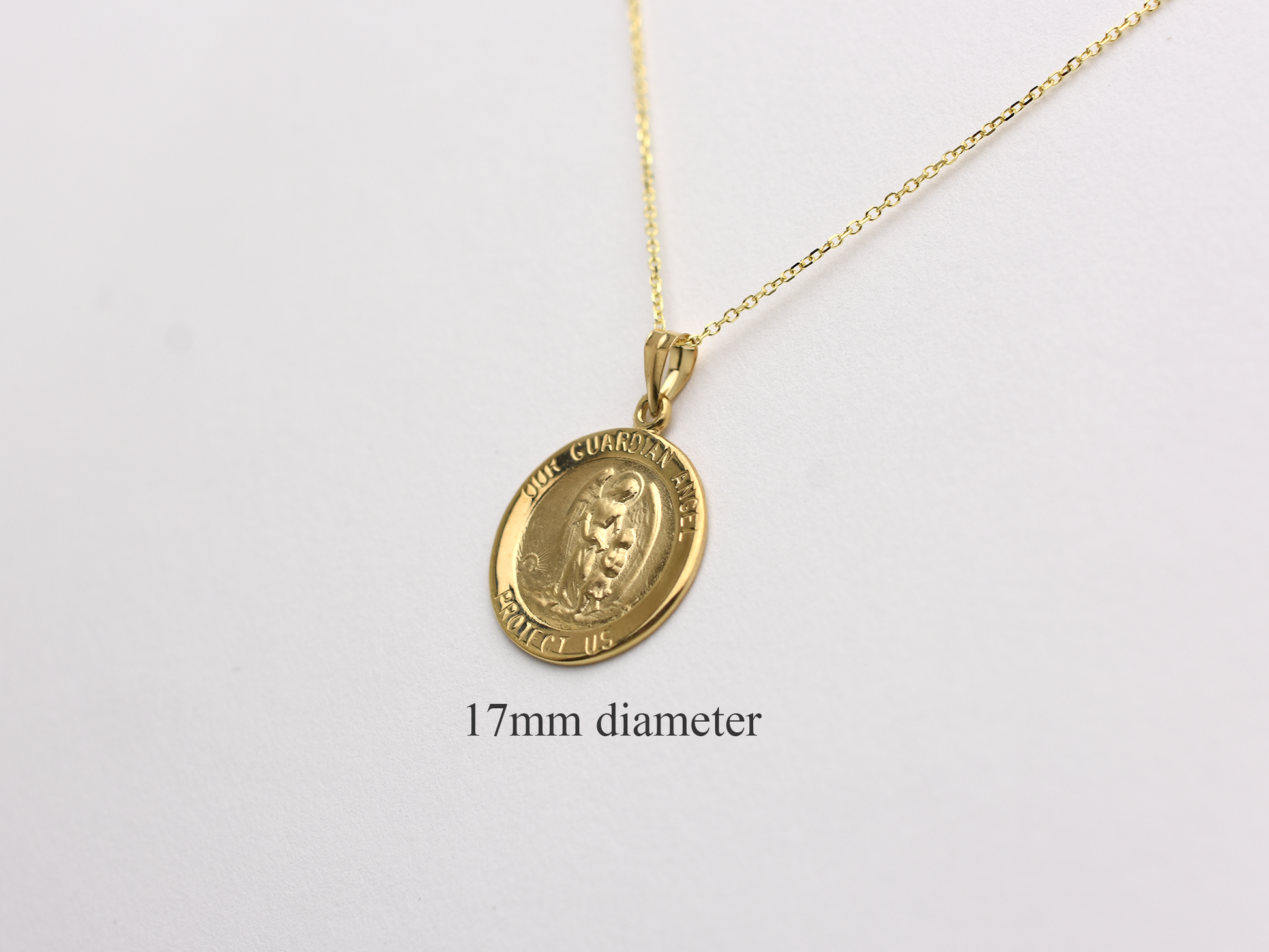 14k solid gold 17 mm Guardian Angel charm necklace .perfect for layering everyday look displayed on a white background . intended for all ages and for men and ladies