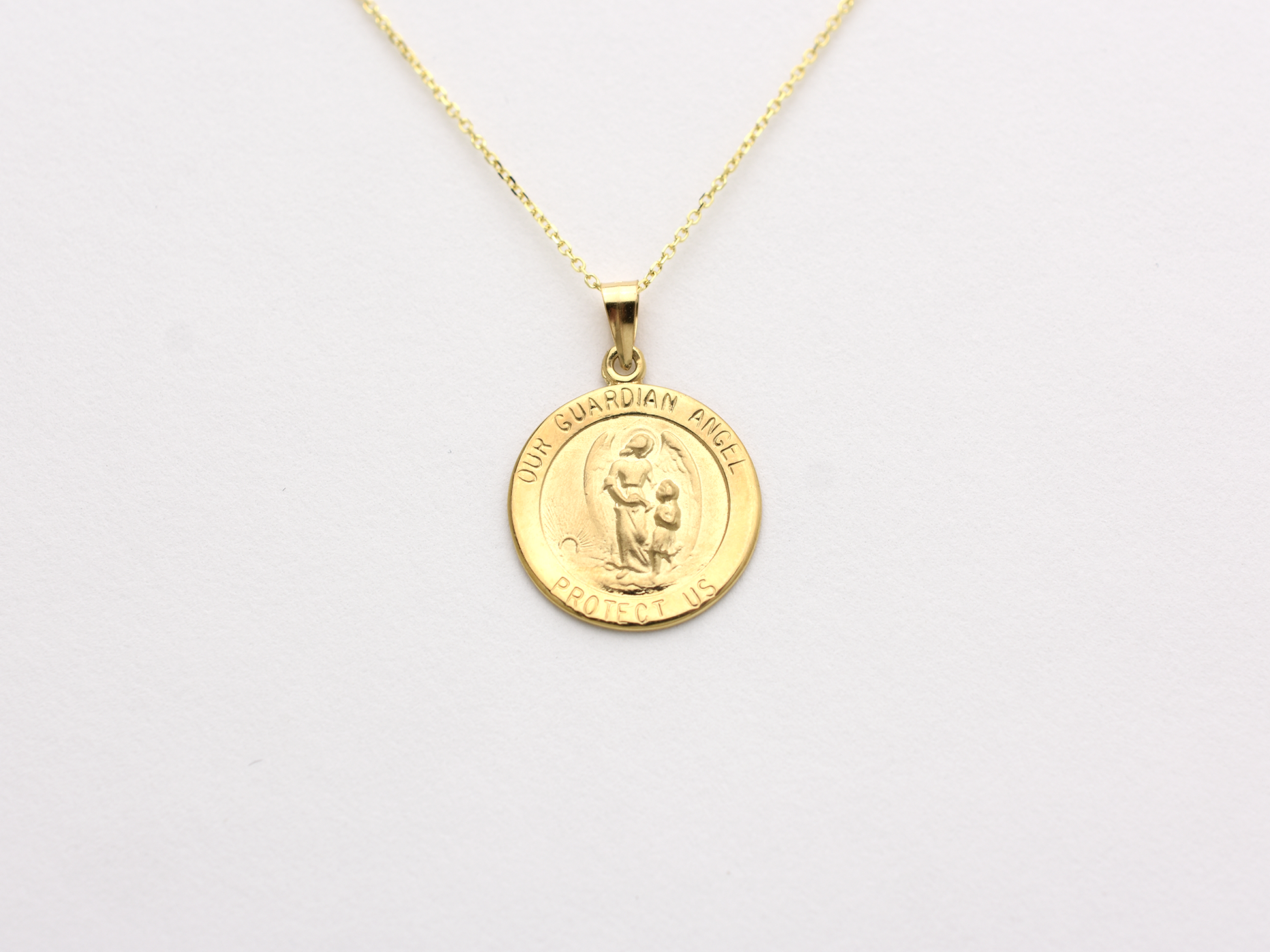 14k solid gold 17 mm Guardian Angel charm necklace .perfect for layering everyday look displayed on a white background . intended for all ages and for men and ladies