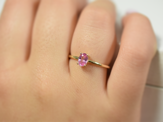on finger pink sapphire ring in 14k gold with 0.56 carat oval stone, dainty fine jewelry gift, minimalist real gold promise ring