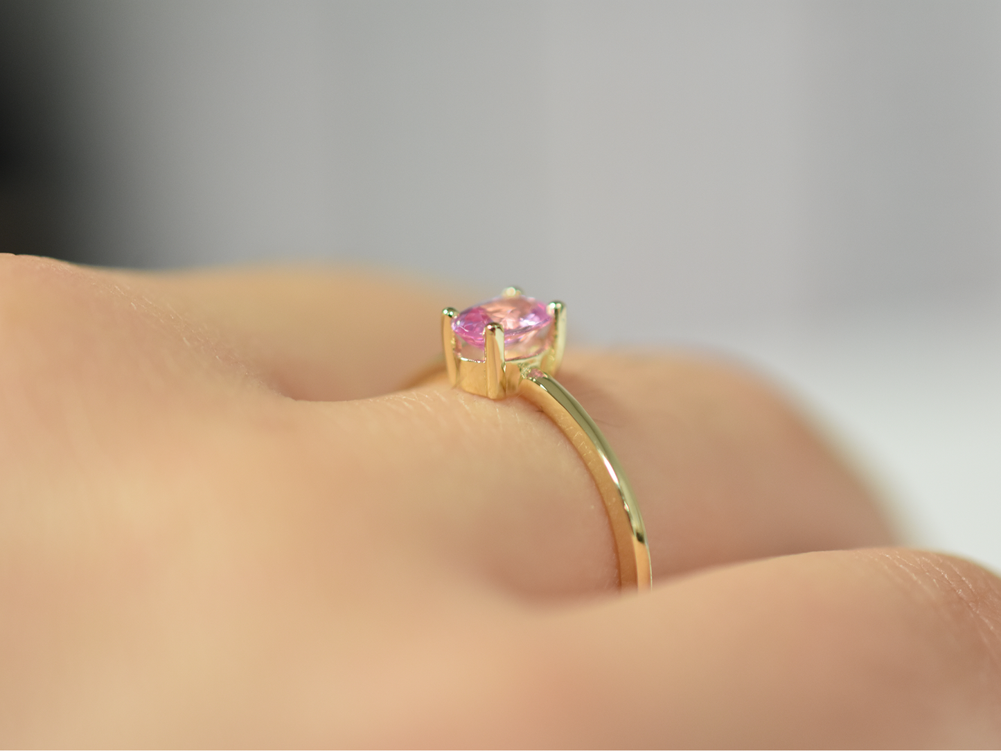 Natural pink sapphire ring in 14k gold with 0.56 carat oval stone, 