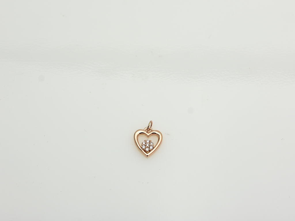 featuring a 14k gold heart necklace with a flower cluster motive 11 mm in dimension . 