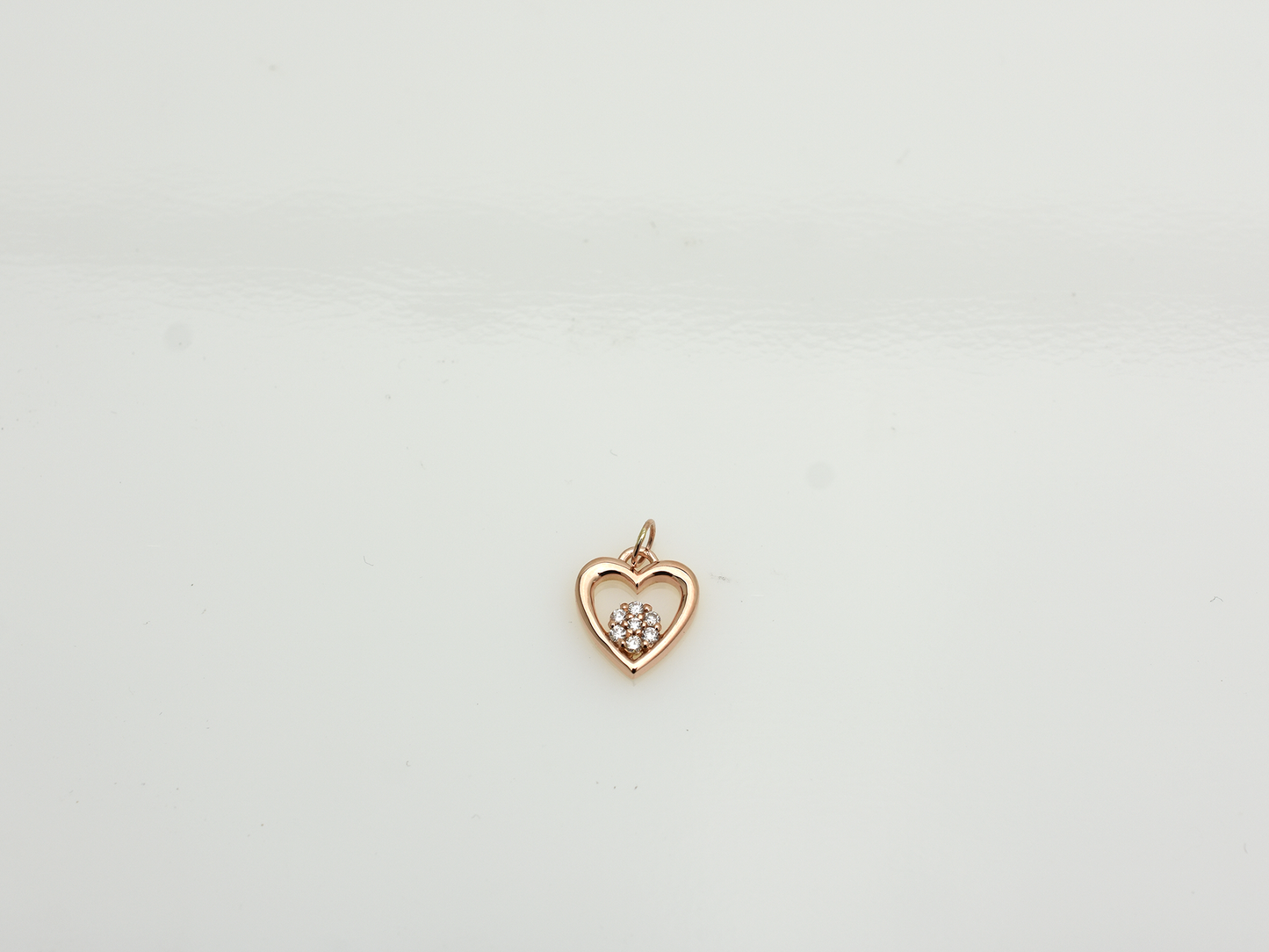 featuring a 14k gold heart necklace with a flower cluster motive 11 mm in dimension . 