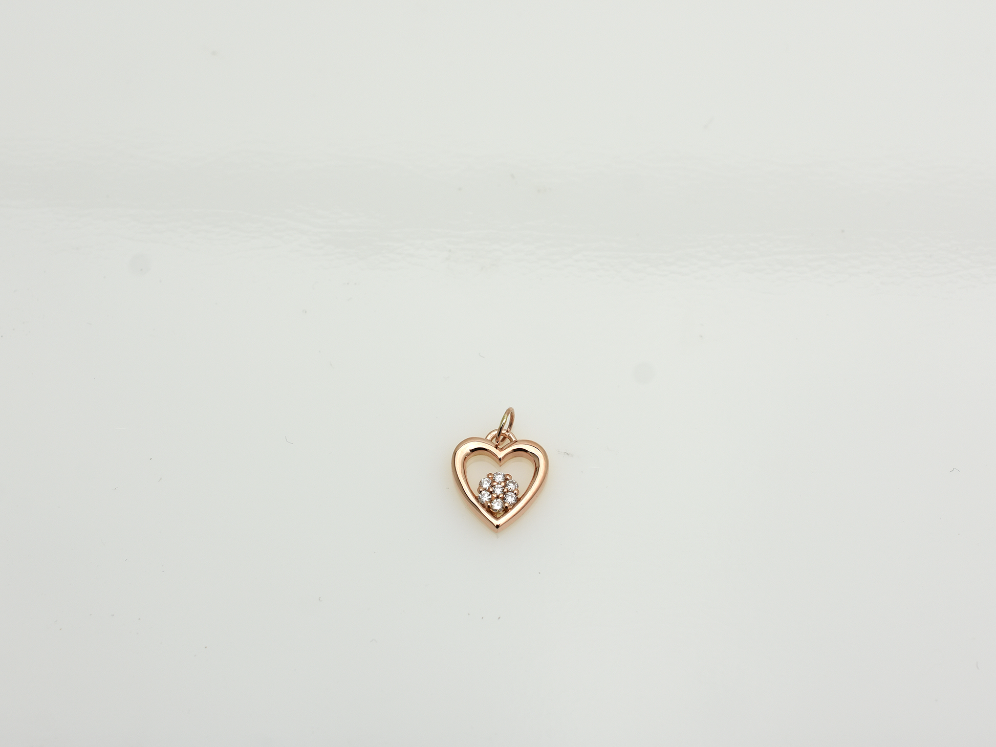 featuring a 14k gold heart necklace with a flower cluster motive 11 mm in dimension . 