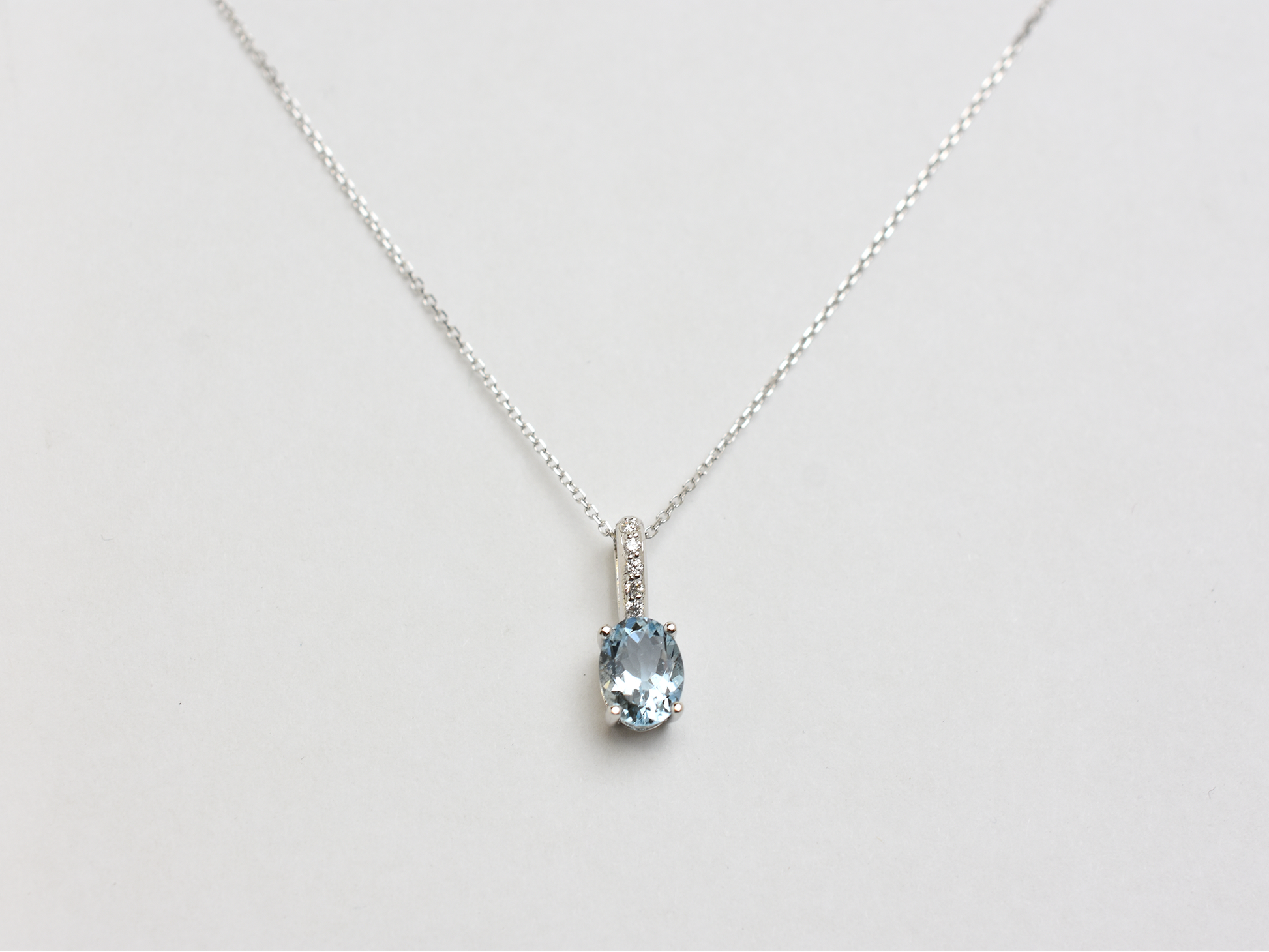 14k gold Oval aquamarine and diamond pendant