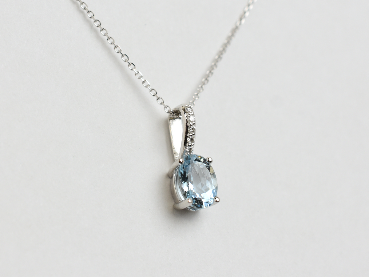 14k gold Oval aquamarine and diamond pendant