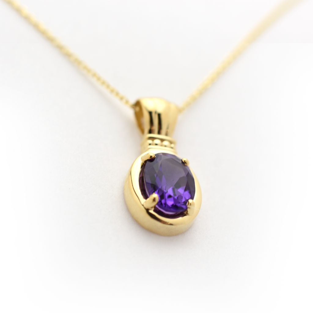 Close up oval amethyst pendant