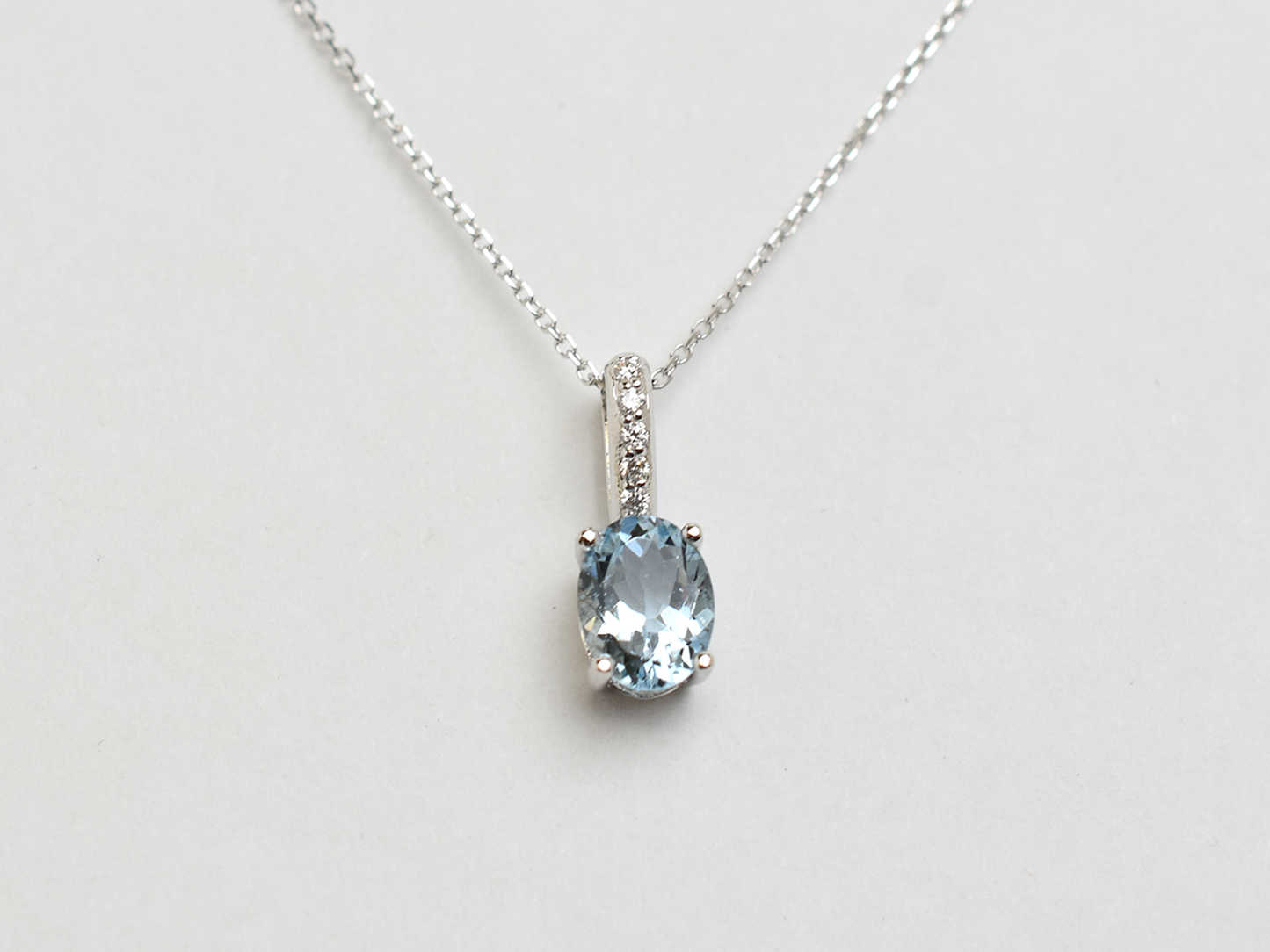 14k gold Oval aquamarine and diamond pendant