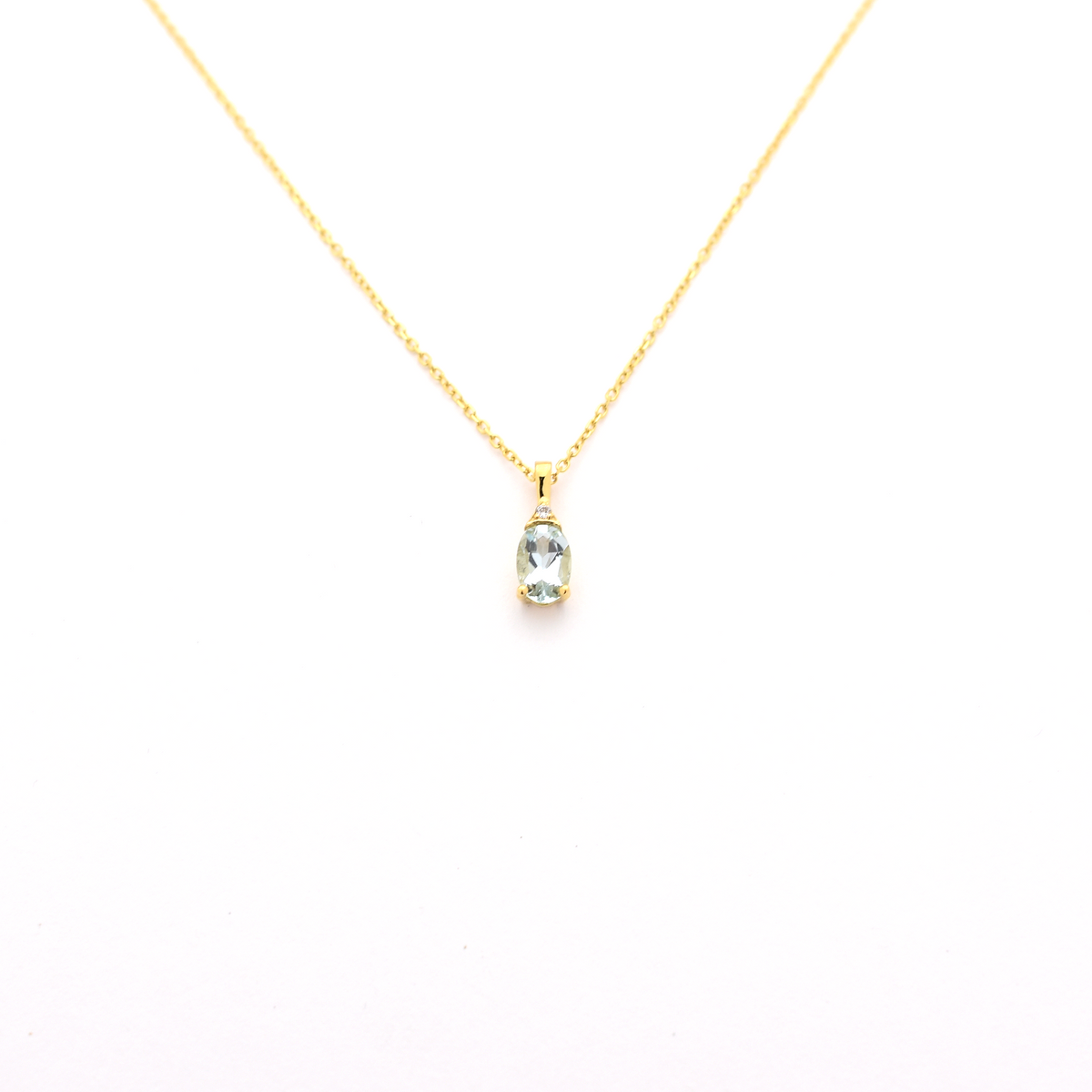 Oval Aquamarine and diamond pendant