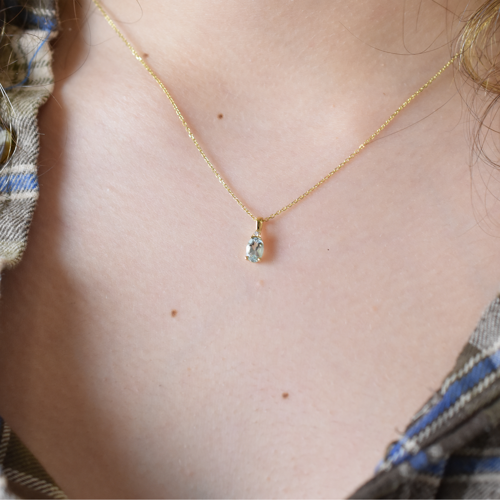 Oval Aquamarine and diamond pendant