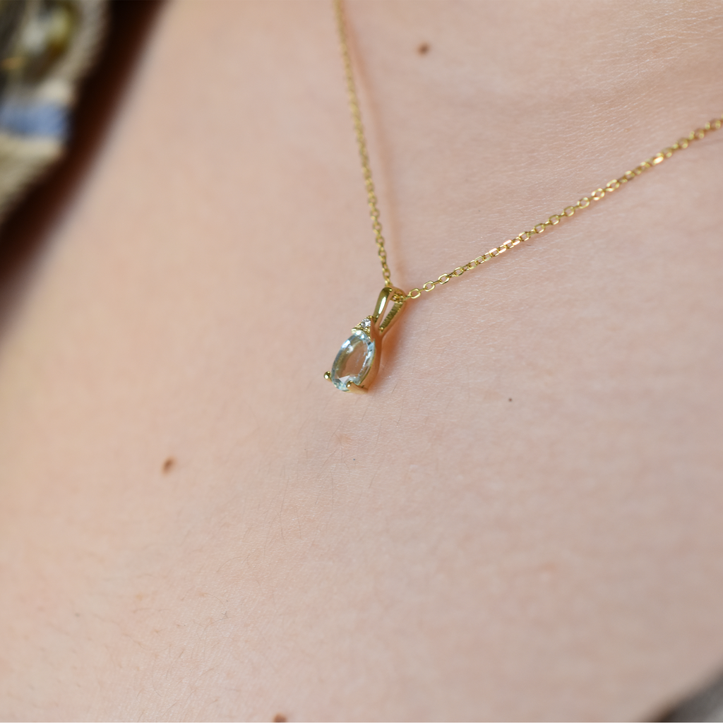 Oval Aquamarine and diamond pendant