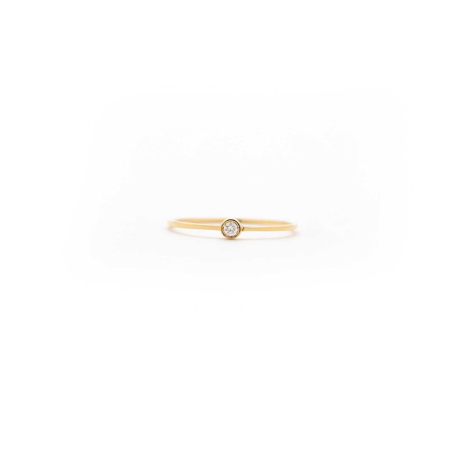 delicate bezel set diamond ring