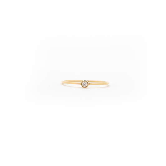 delicate bezel set diamond ring