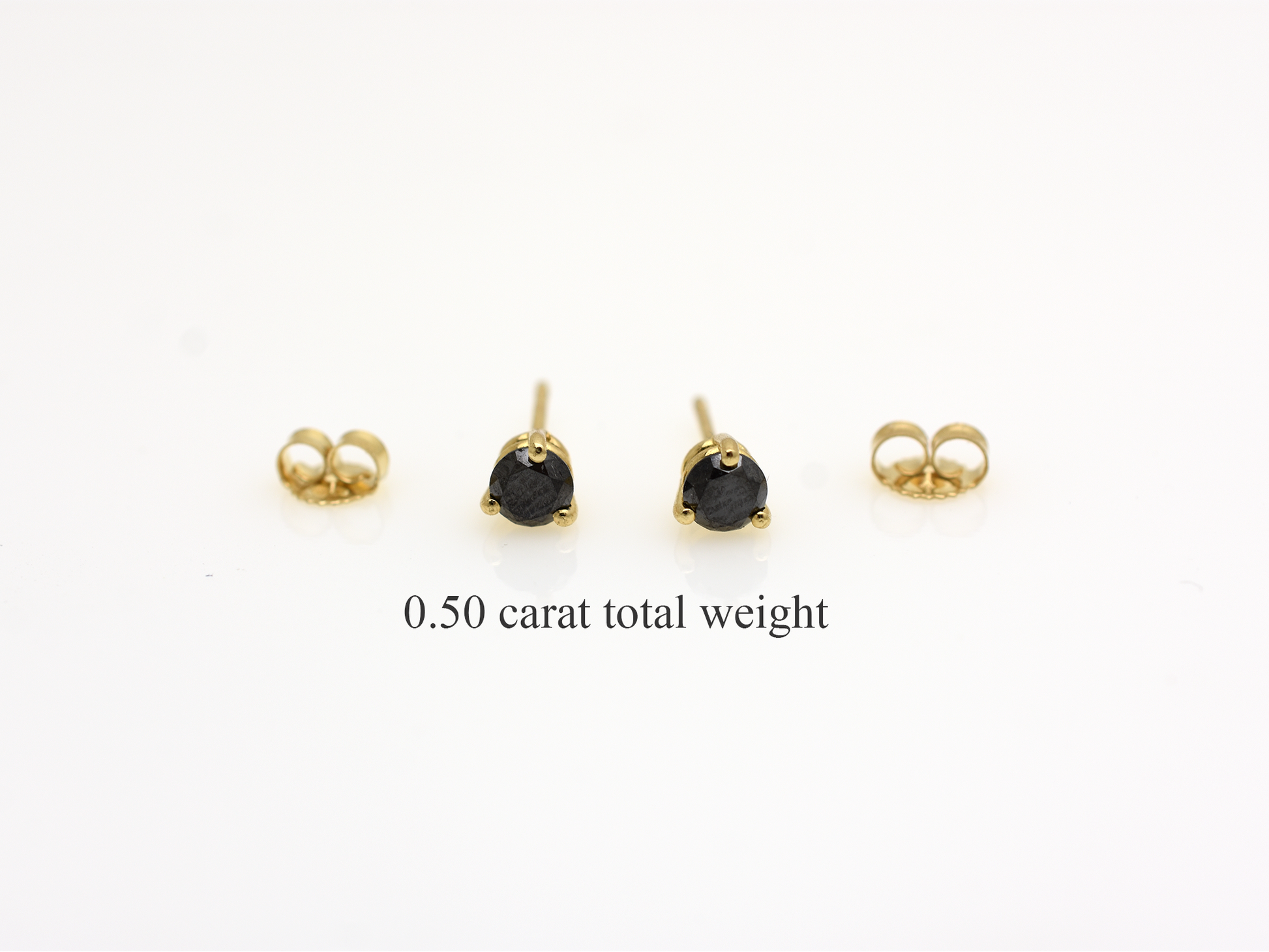 14k gold black diamond stud earrings with a 0.50 carat round shape black diamonds 
