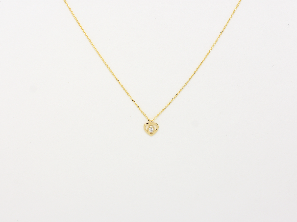 14k solid gold Heart necklace with one diamond in the center