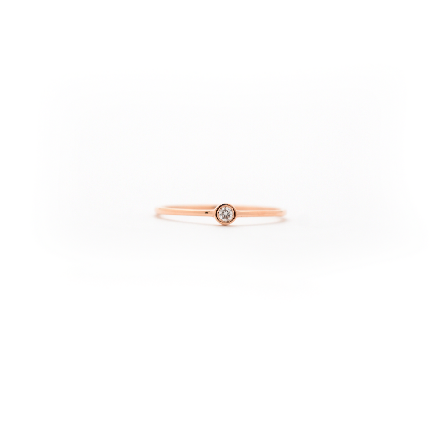 delicate bezel set diamond ring