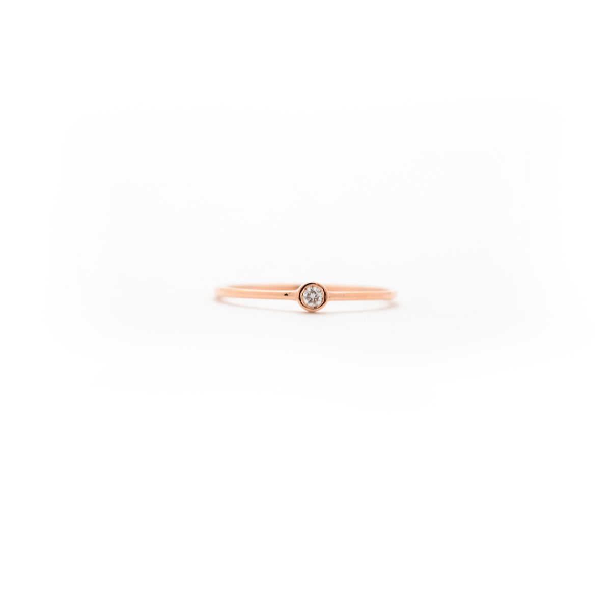 delicate bezel set diamond ring