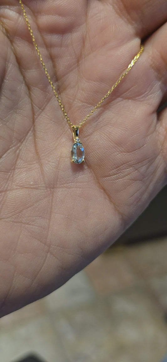 Oval Aquamarine and diamond pendant