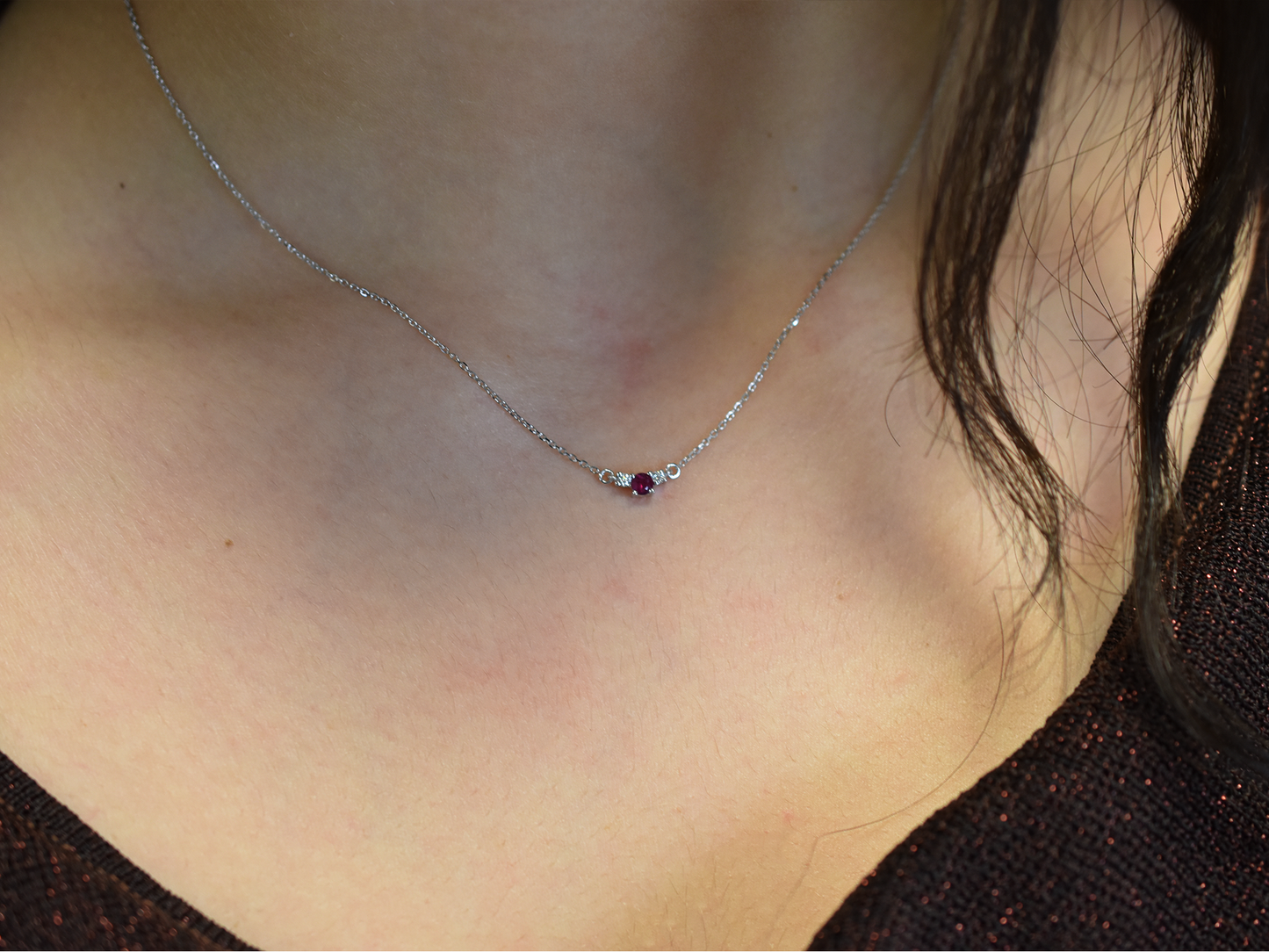 14k gold diamond and ruby necklace . past present and future design mini size pendant. the chain is a 0.8 mm cable link chain dainty and everyday look on a model