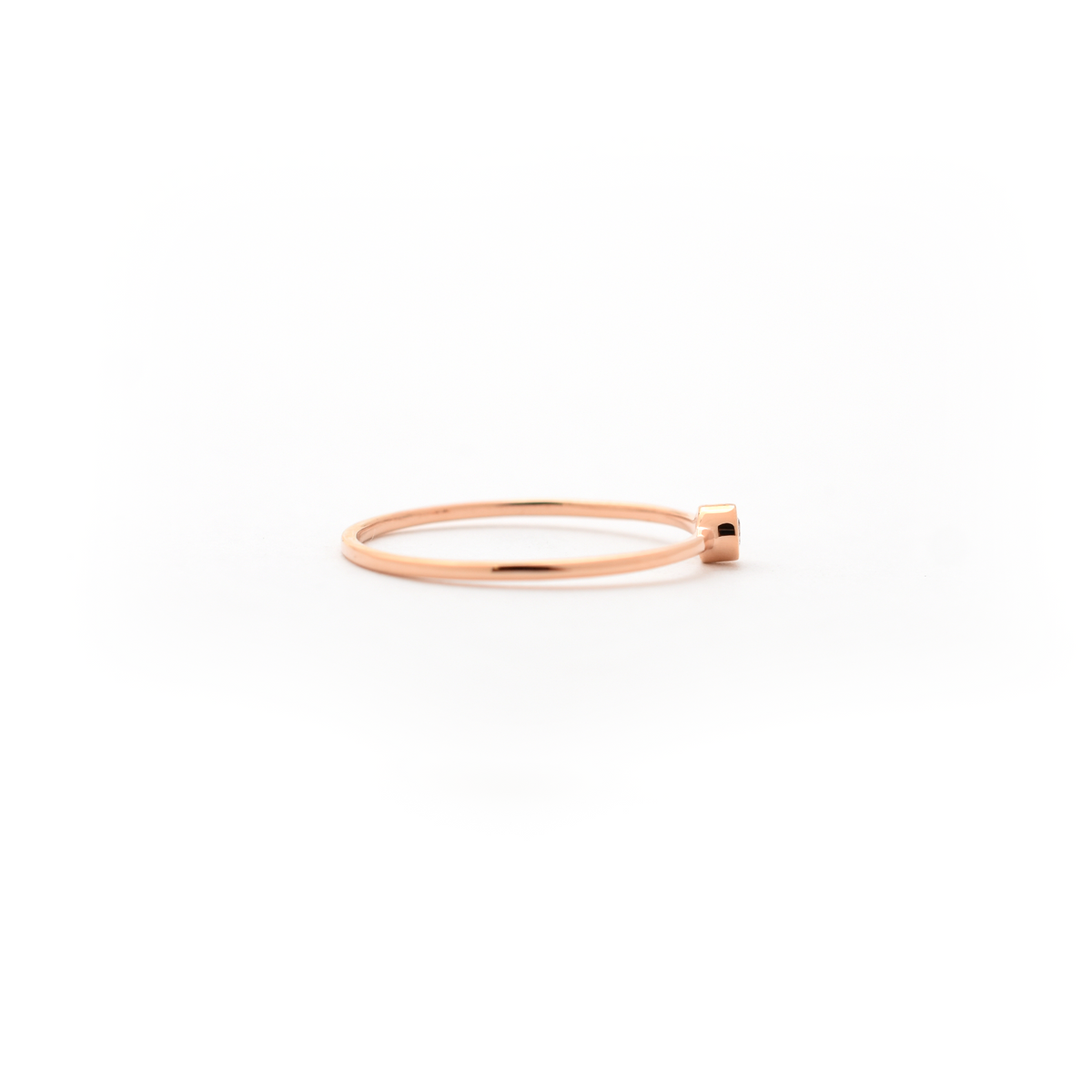 delicate bezel set diamond ring
