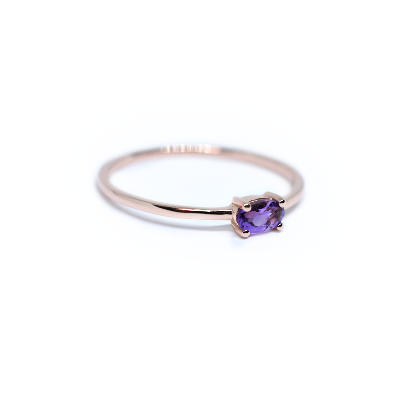 side view east and west oval Amethyst set in 4 prong setting