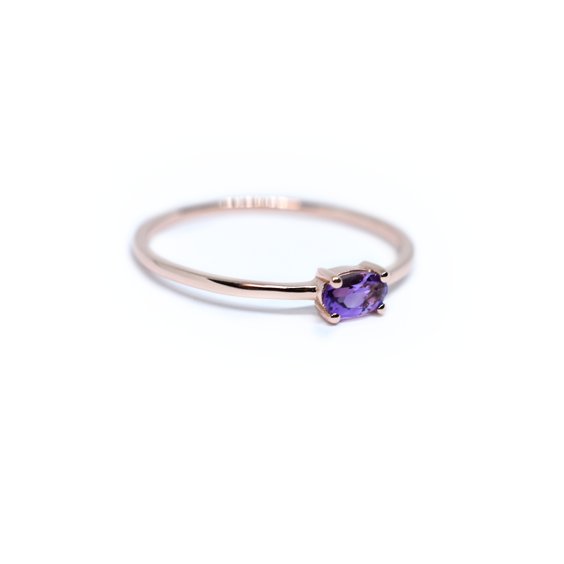 side view east and west oval Amethyst set in 4 prong setting