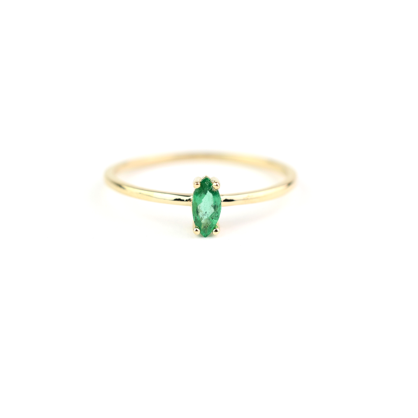 14k gold marquise shaped natural emerald set in a 4 prong setting 