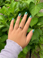 14k gold and natural oval amethyst solitaire ring on hand