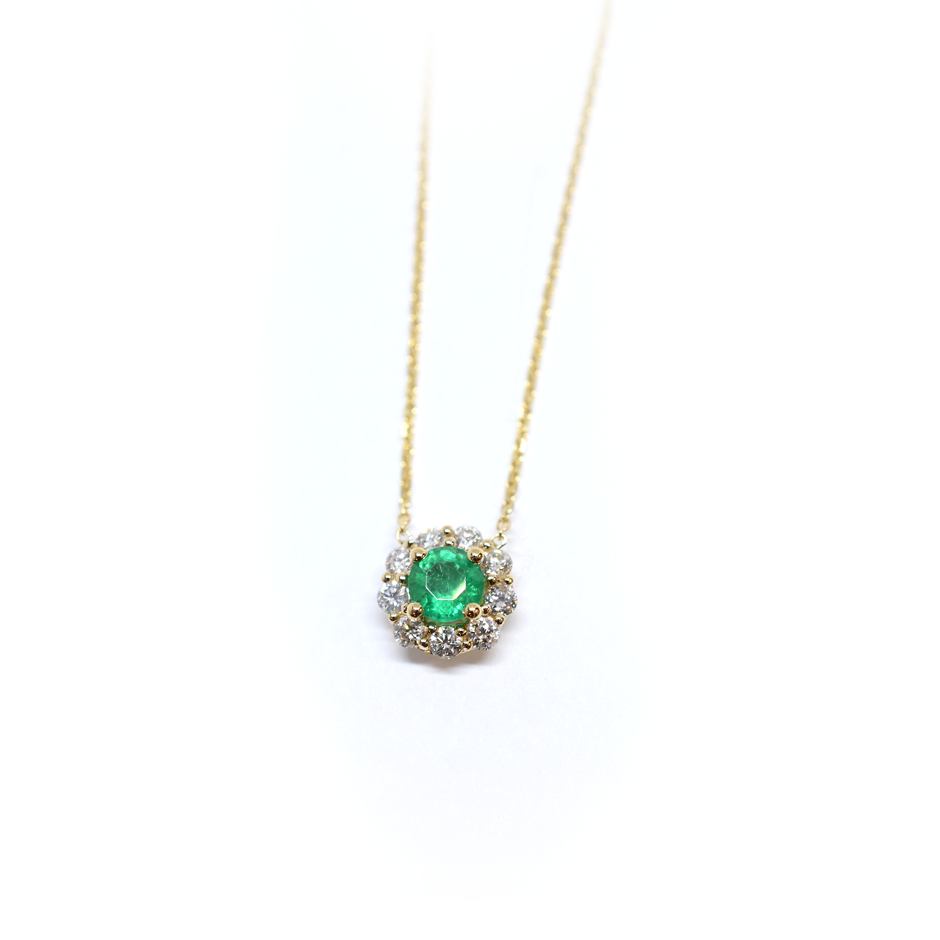 14k yellow gold emerald and diamond halo necklace with green emerald center stone, May birthstone jewelry
