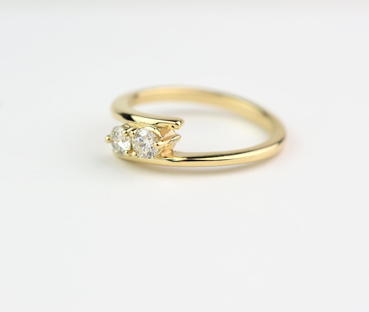 14k yellow gold two-stone diamond bypass ring with round-cut natural diamonds, elegant anniversary jewelry"